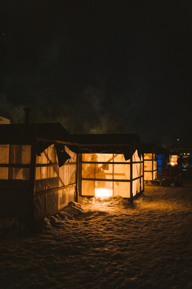 Smelting huts as viewed at night.