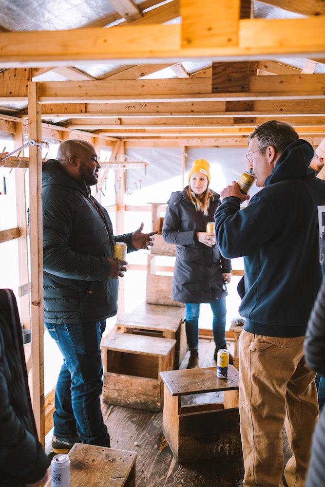 Hanging out in a smelting shack on a Maine river, enjoying Allagash White