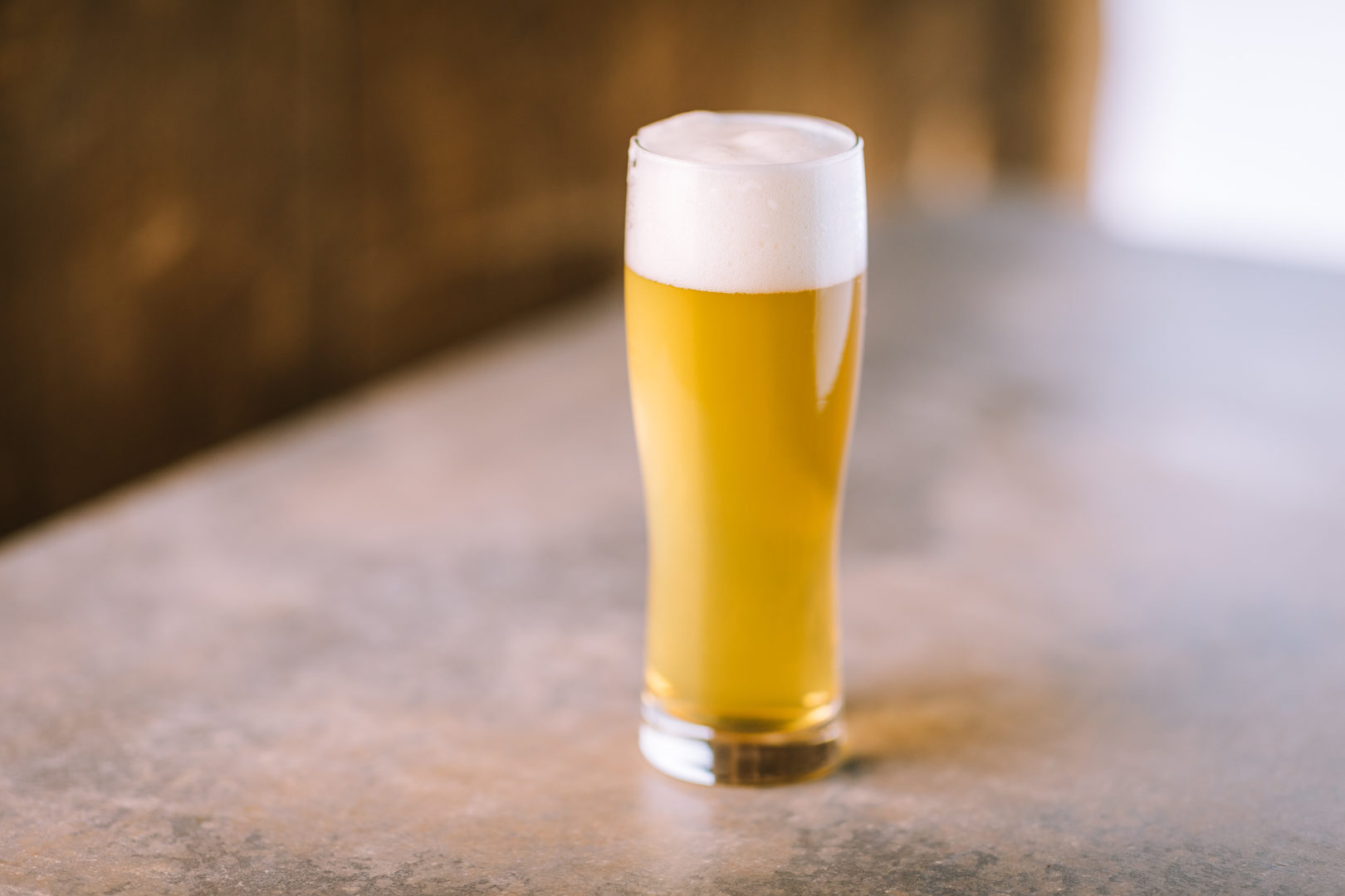 Allagash Truepenny Pilsner in a glass