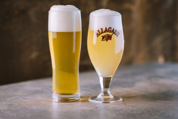Allagash White next to an unlabeled beer.