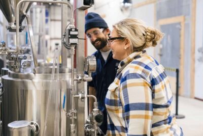 Two people brewing on the pilot system