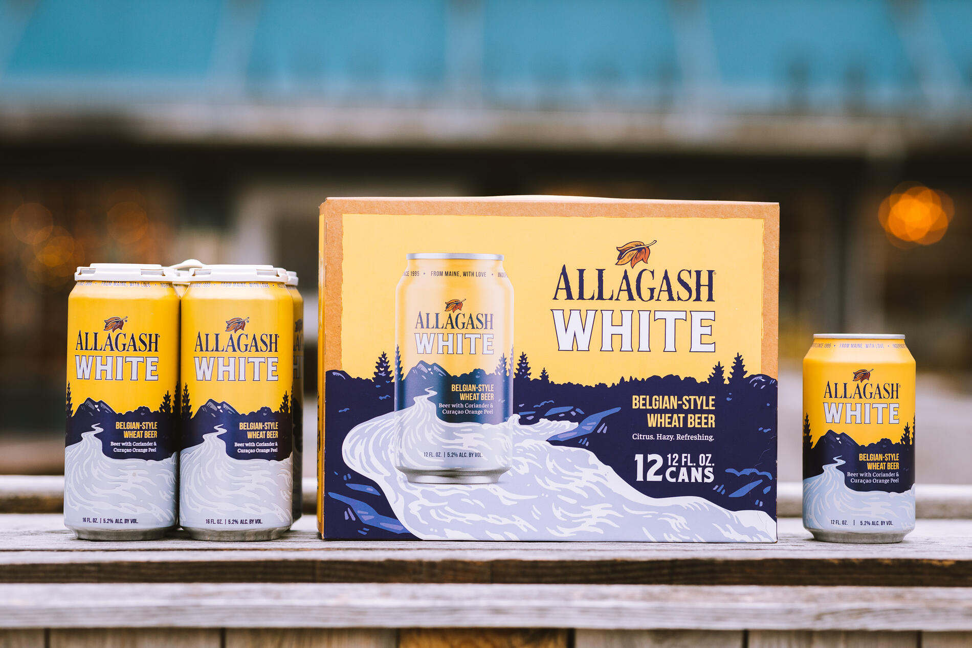 Cans of Allagash White sitting on a table