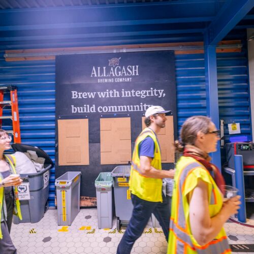 AllagashTourPic_6 Group of people walks through Allagash Brewing company on a tour