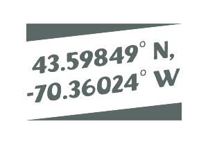 Allagash Bungalow sign displayed in the front window saying the coordinates for the scarborough bungalow