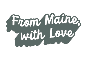 Allagash Bungalow sign displayed in the front window saying from maine with love