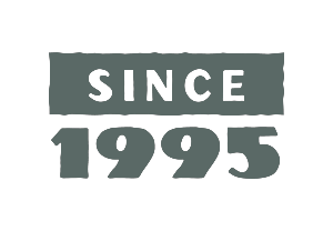 Allagash Bungalow sign displayed in the front window saying since 1995