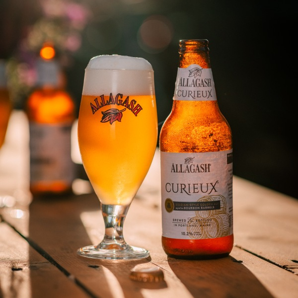 Allagash Curieux is a bourbon barrel-aged Tripel. And you're looking at it in a glass and a bottle