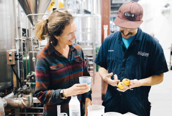 Two employees brew a pilot beer on our 10-gallon experimental system