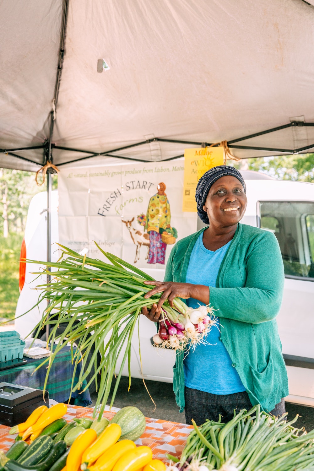 Christine is a farmer selling her produce at the Portland Farmers Market