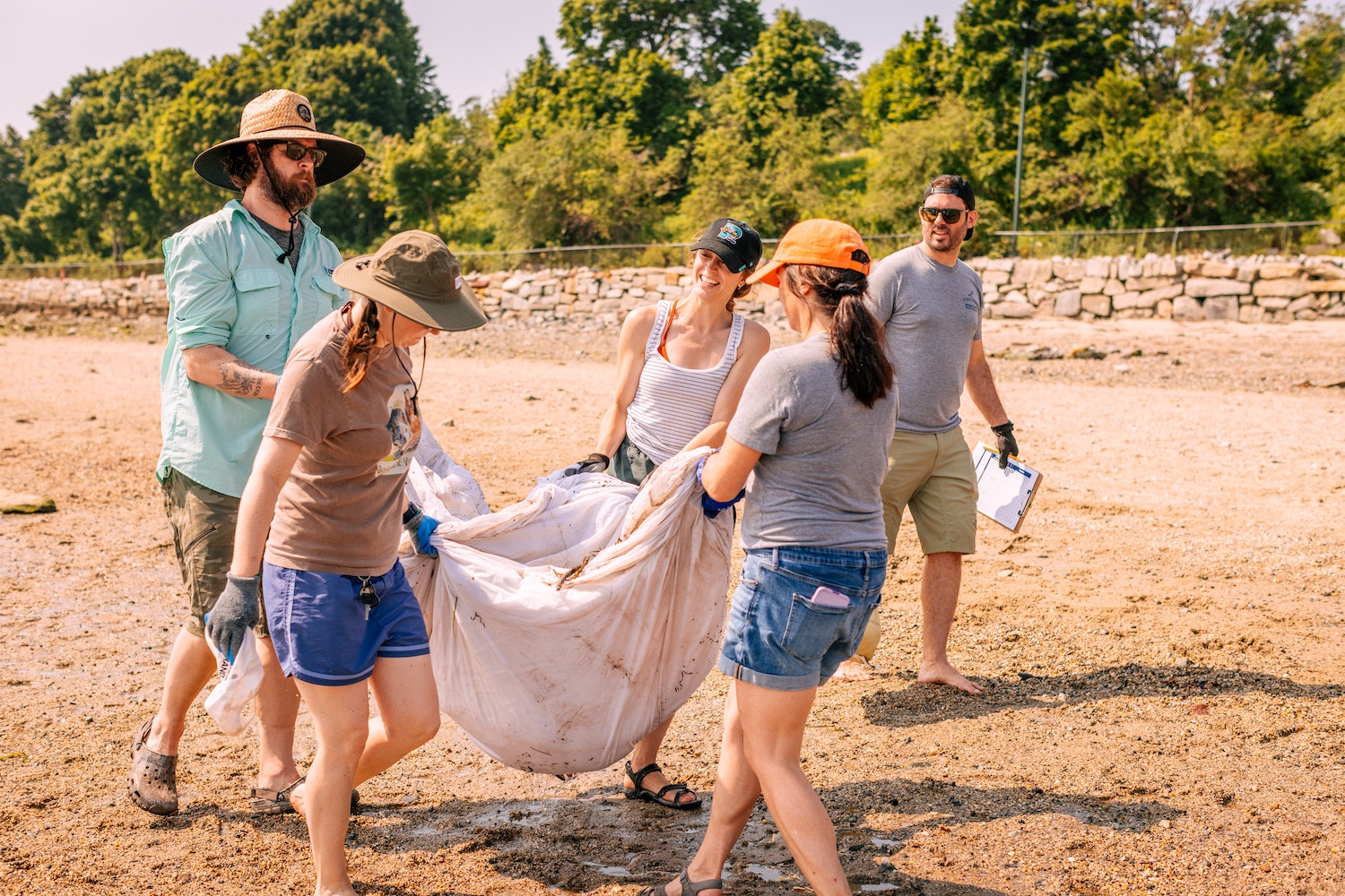 A crew from Allagash cleans up the east end beach.