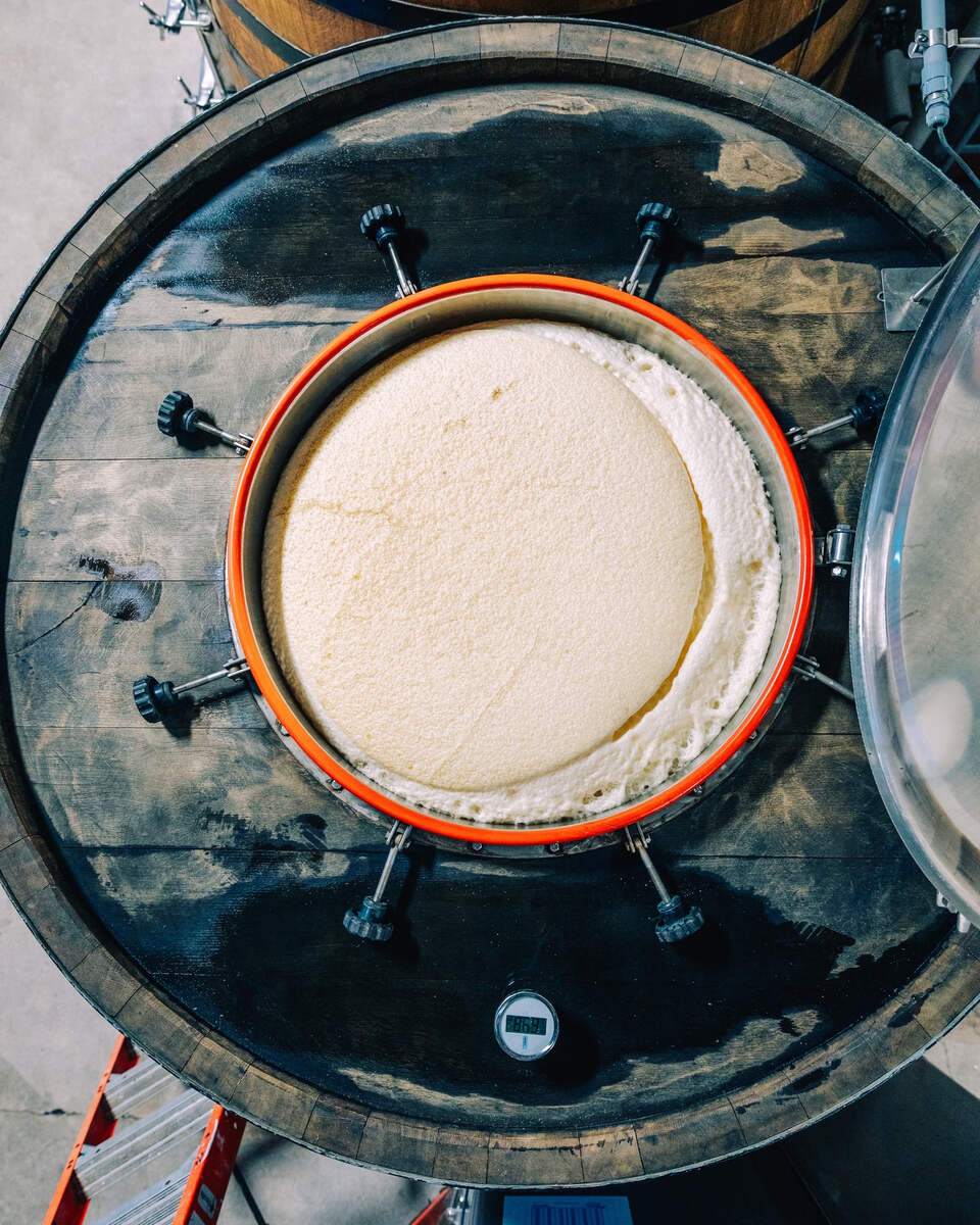 Looking down into the top of a fermenting foudre