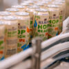 Allagash Hop Reach IPA rolling down the canning line