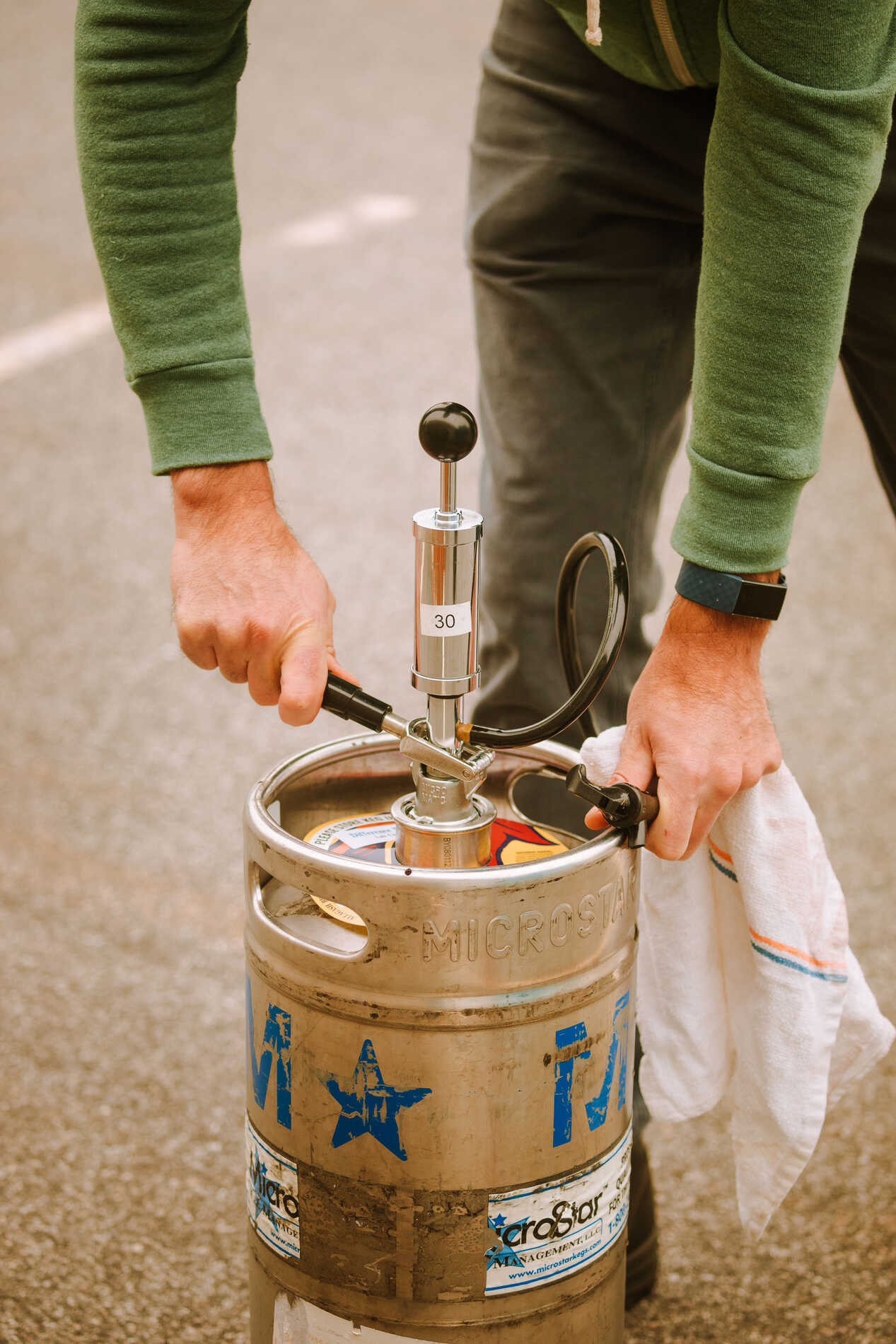 Demonstration on how to tap a keg: STEP 3: Turn the tap clockwise until you feel resistance. No need to crank on it, just make sure it’s snug.