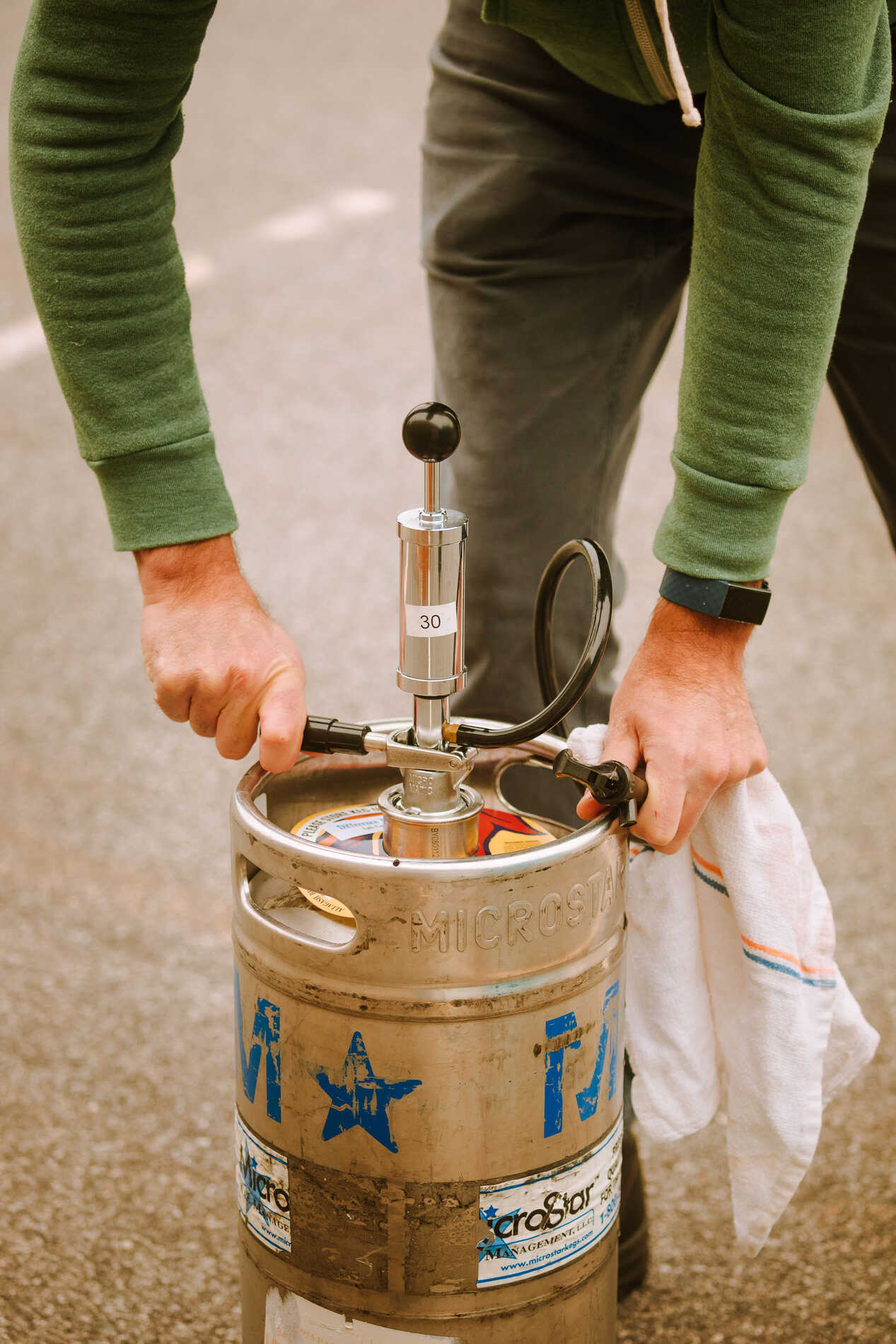 Demo on tapping a keg. STEP 4: Push down on the handle to tap the keg. Pump a couple of times (don’t overpump!) and you’re ready to pour.