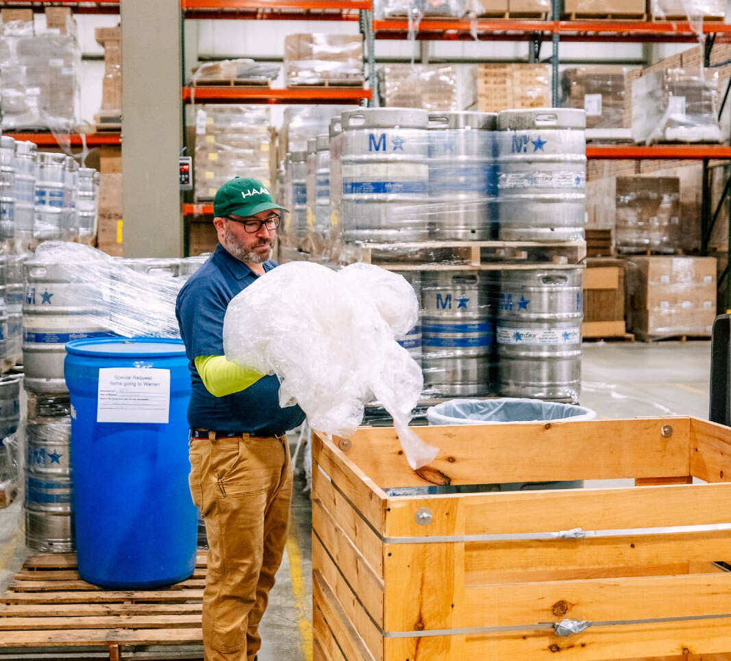Bob fills a bin with plastic wrap for recycling