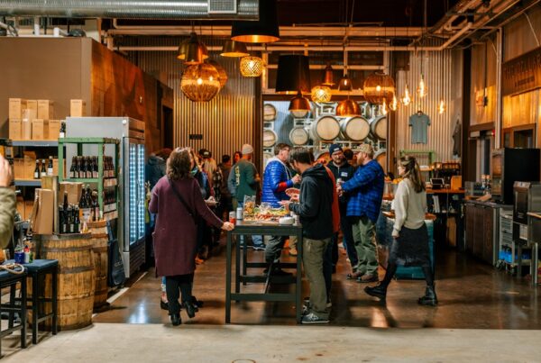 People gathering in the Cellars at Allagash