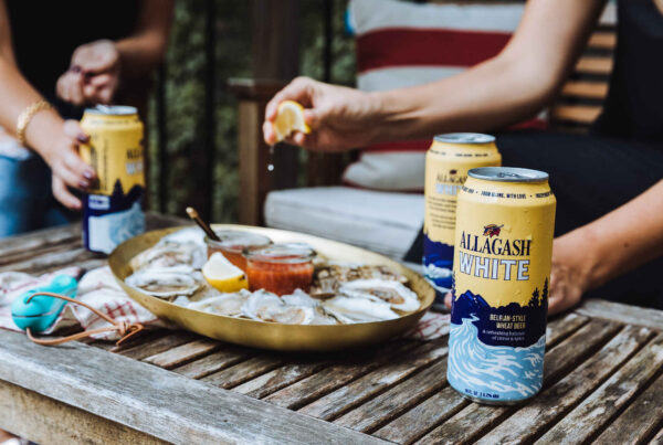 Allagash White cans in their natural habitat: with friends.