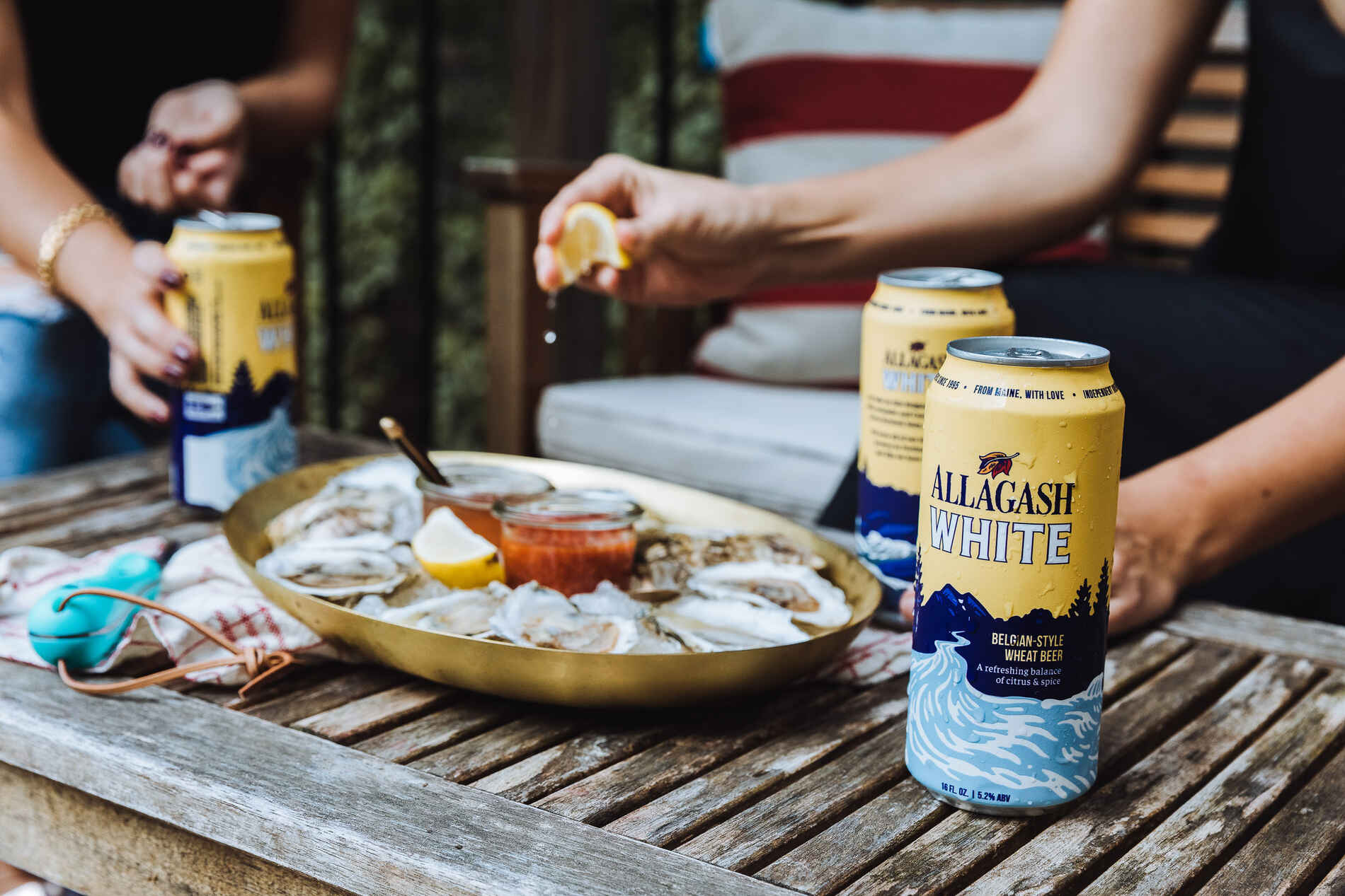 Allagash White cans in their natural habitat: with friends.